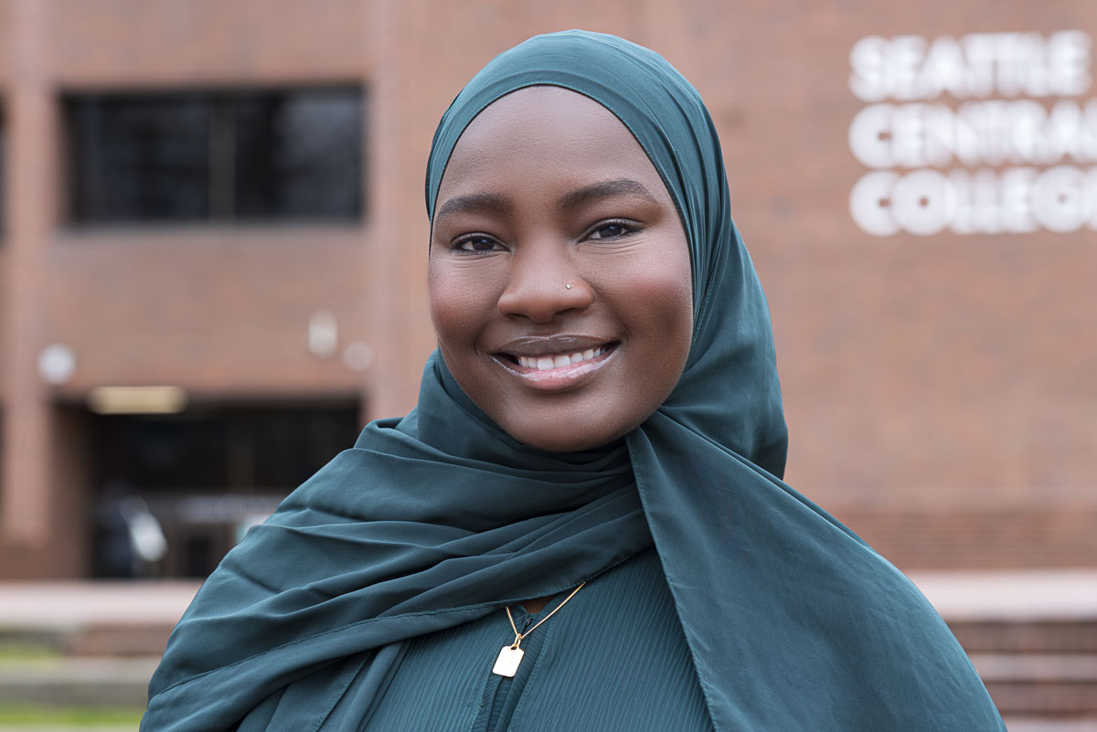 Latifa Souleyman smiling in front of Seattle Central College exterior