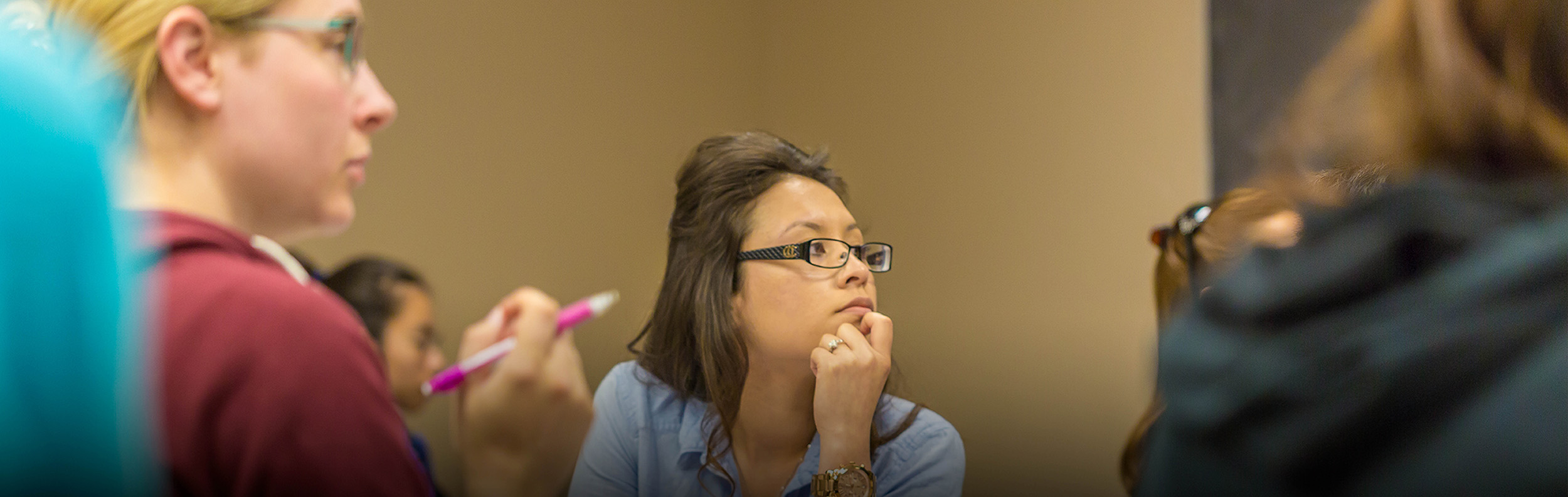 a groups of students in a classroom setting