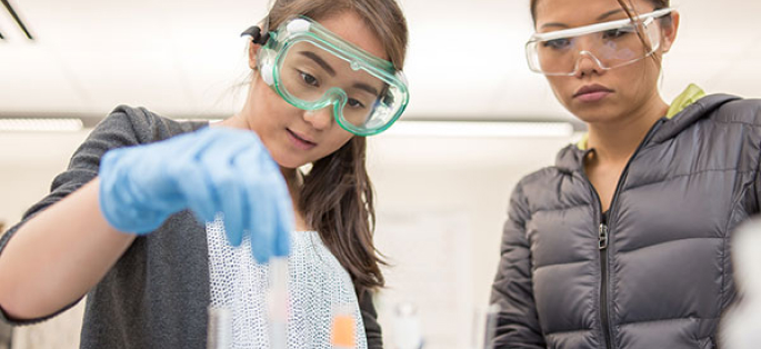 two students in a chemistry class