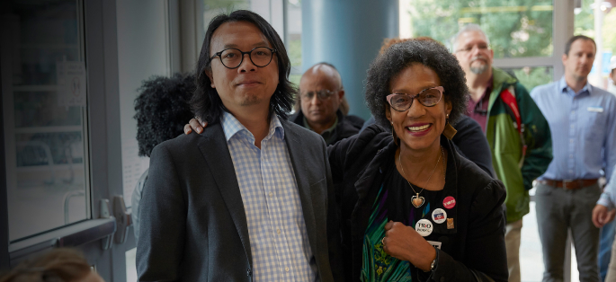 people walking side by side attending a Seattle Colleges event