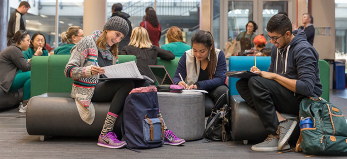 North Seattle College students working together in open study area