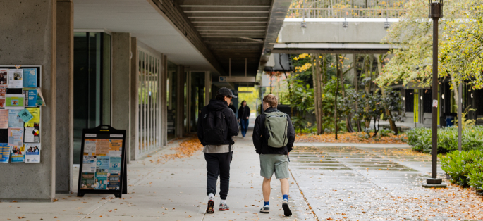 two students walking outside North Seattle College