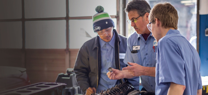 Students and faculty in automotive class