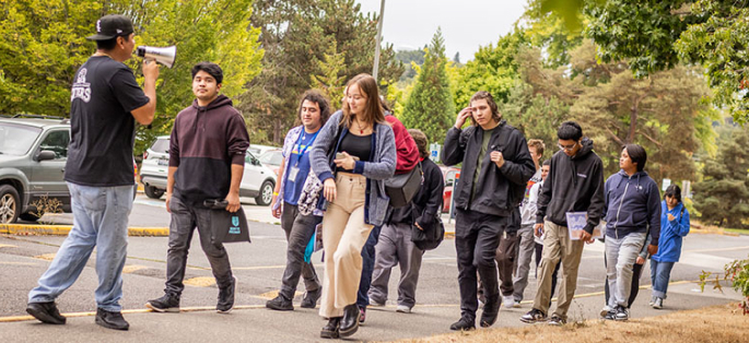 Students and faculty walking on a field trip