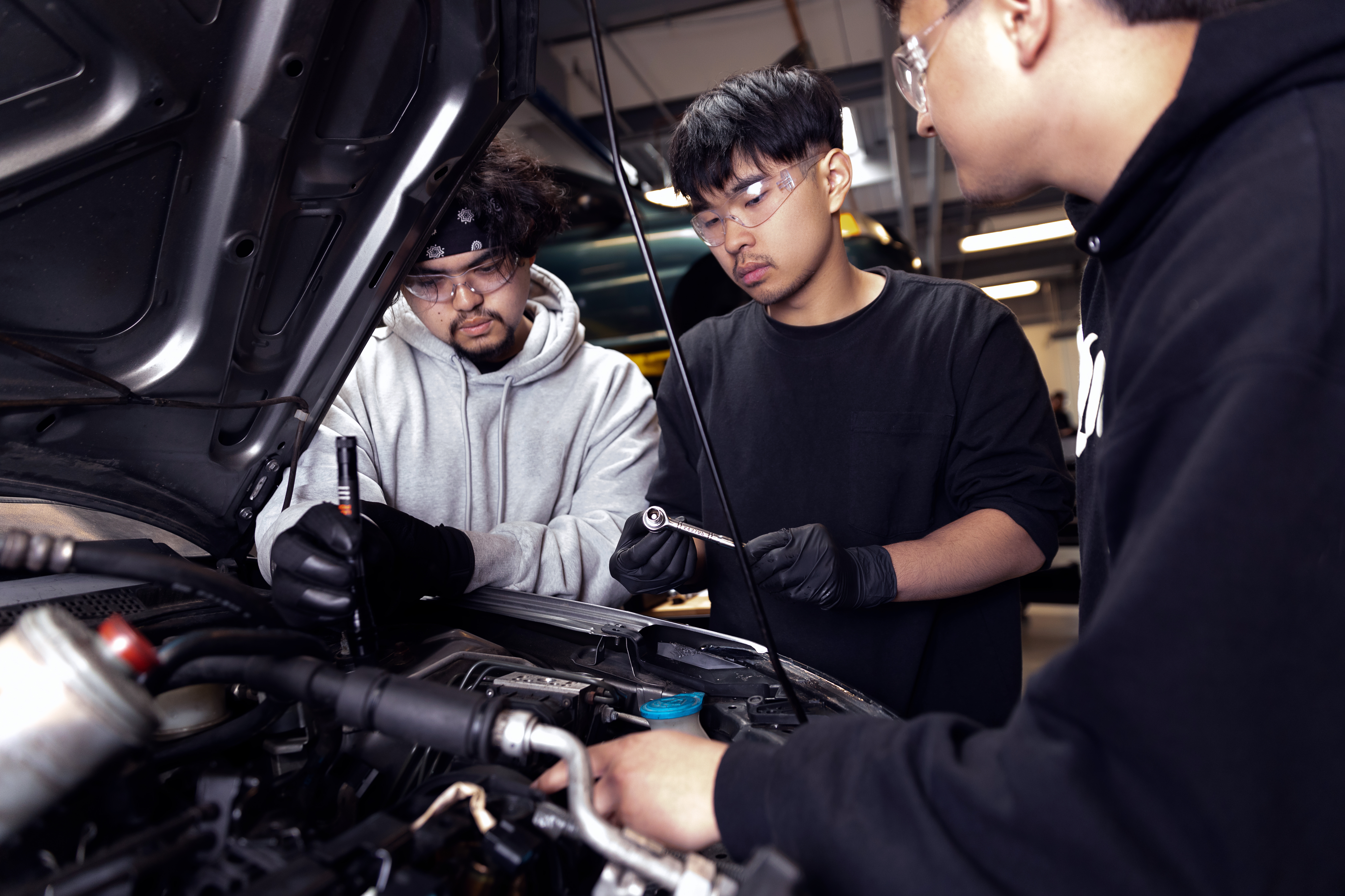 Automotive technology students working on a car at South Seattle College